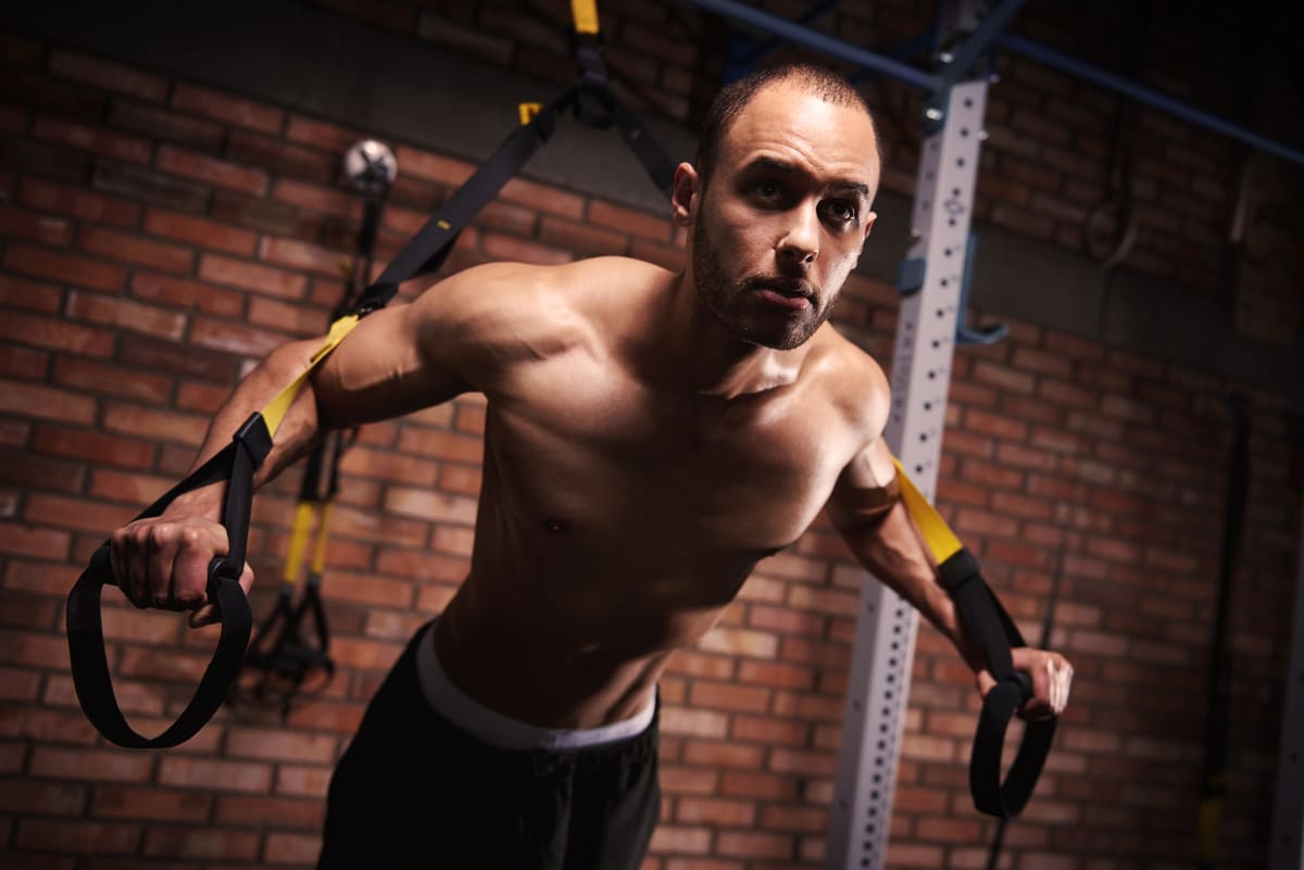 male athlete working out with resistance bands 1 1